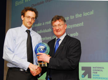 Matt Hutchinson, CommIT Project Manager, LUVU, receiving the award from David Frost, Director General of the British Chambers of Commerce